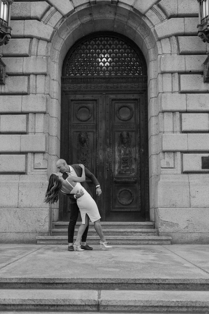 couple kissing in front of city hall downtown Cleveland Ohio