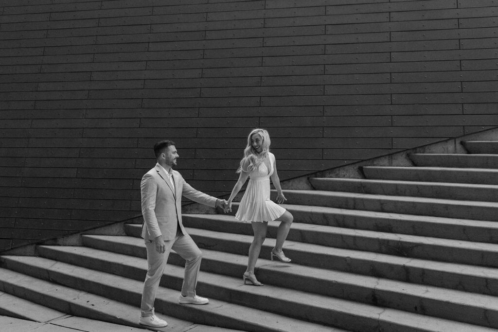 couple walking up stairs in the flats downtown Cleveland ohio