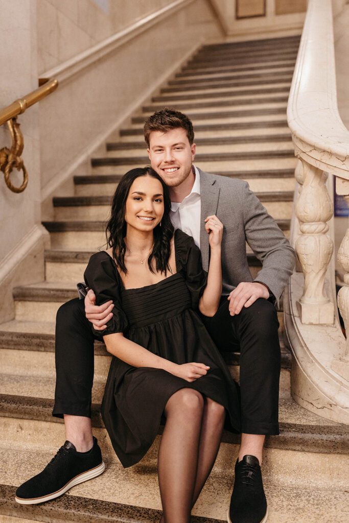couple smiling on staircase