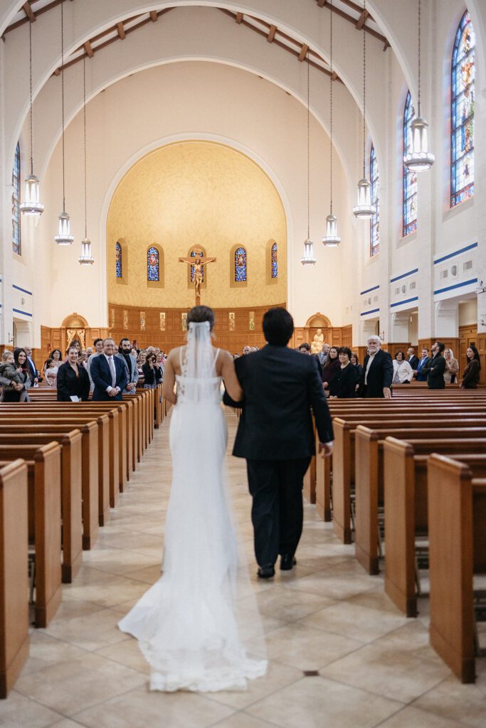 catholic wedding ceremony in ohio dad walking bride down the aisle