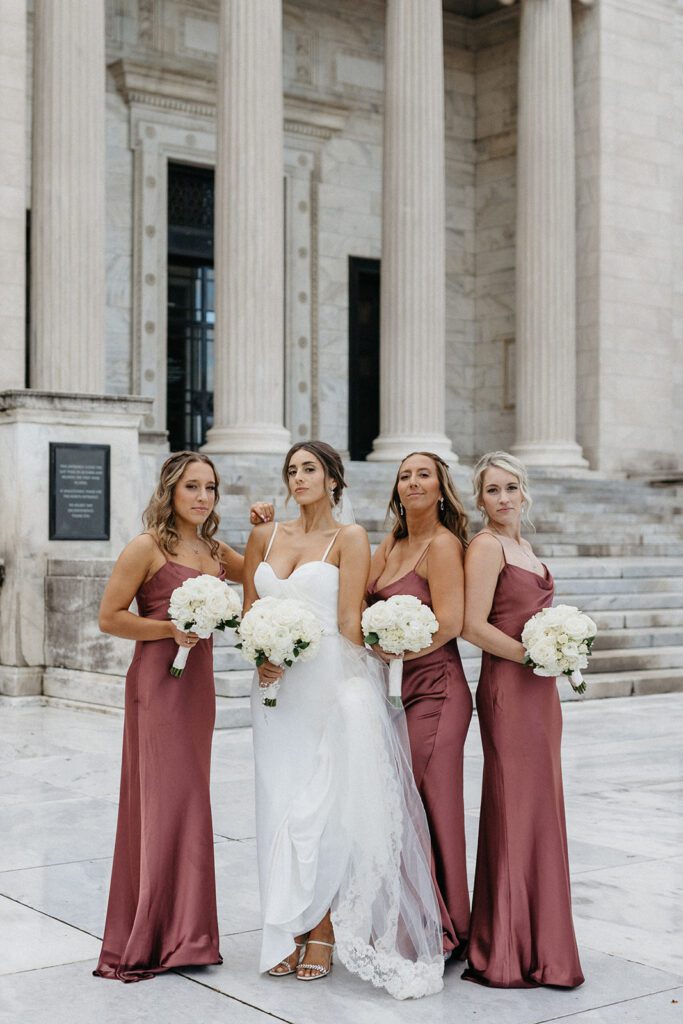 bride posing with bridesmaids