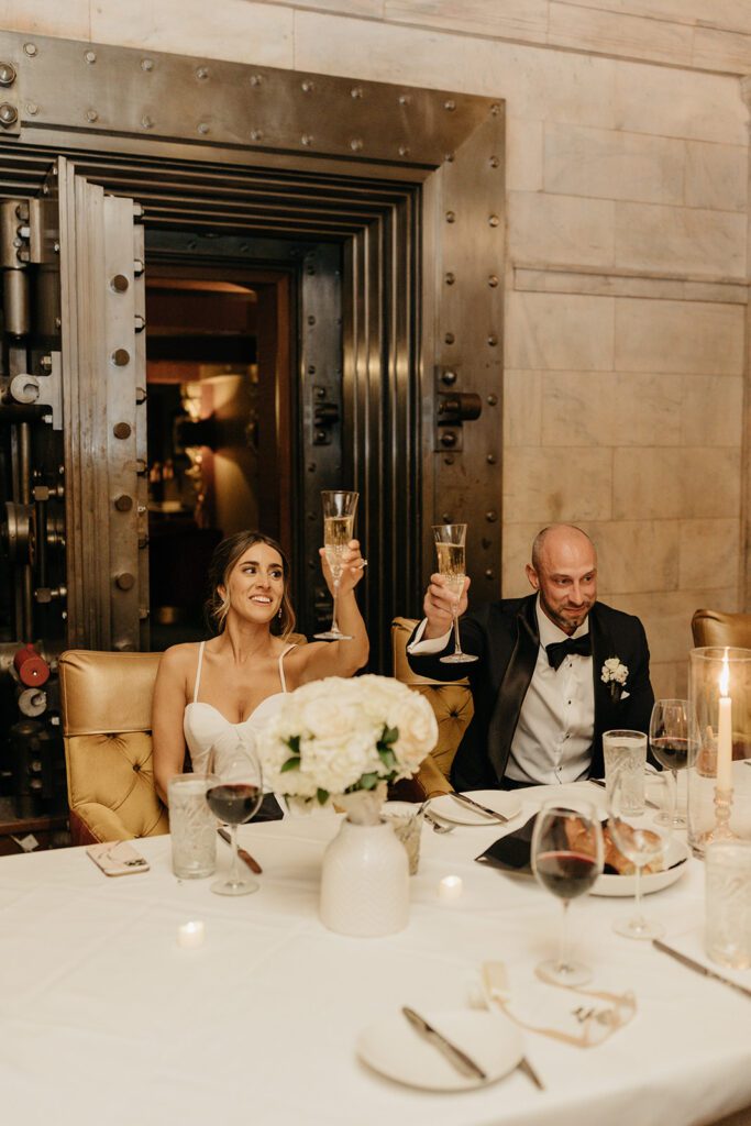 bride and groom raising a glass to toast downtown cleveland oh
