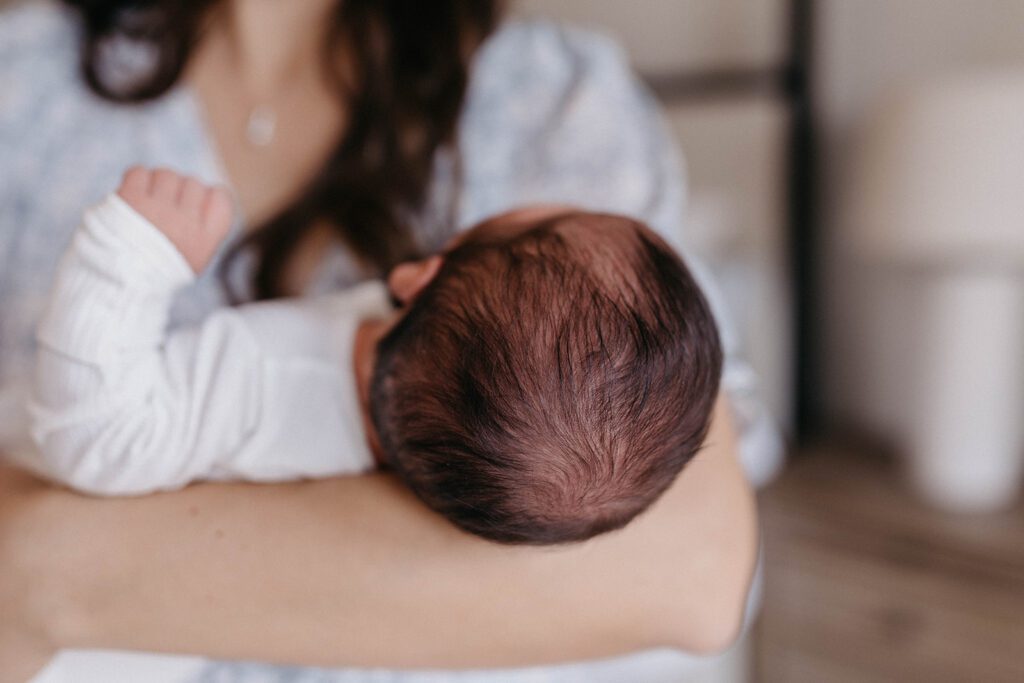 newborn photoshoot in home with husband and wife