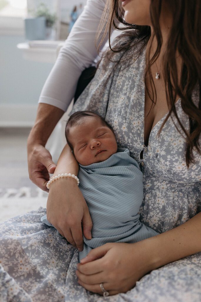 in home lifestyle newborn session photos with husband and wife