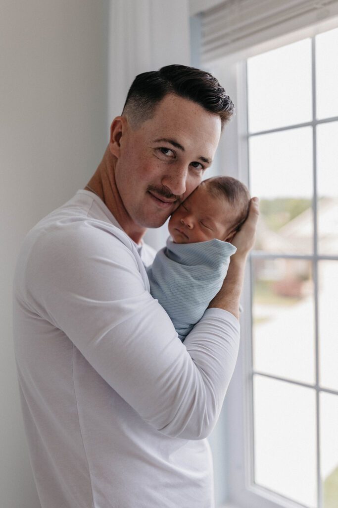 in home newborn session in nursery with dad