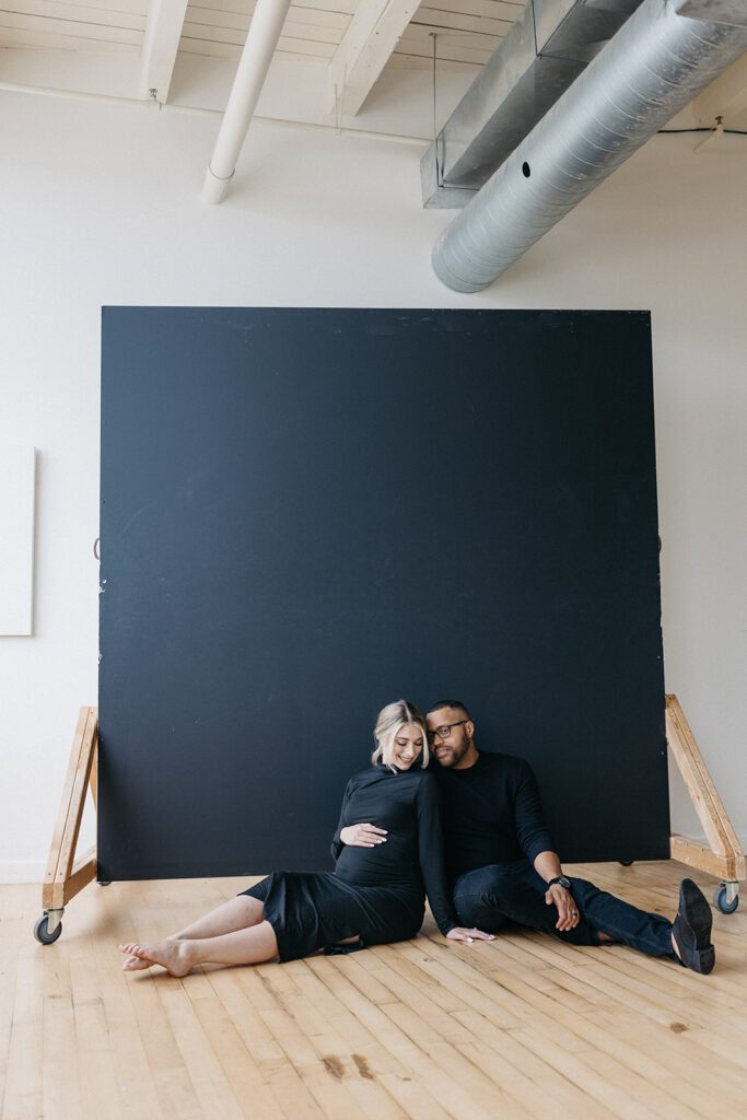 couple in front of studio backdrop