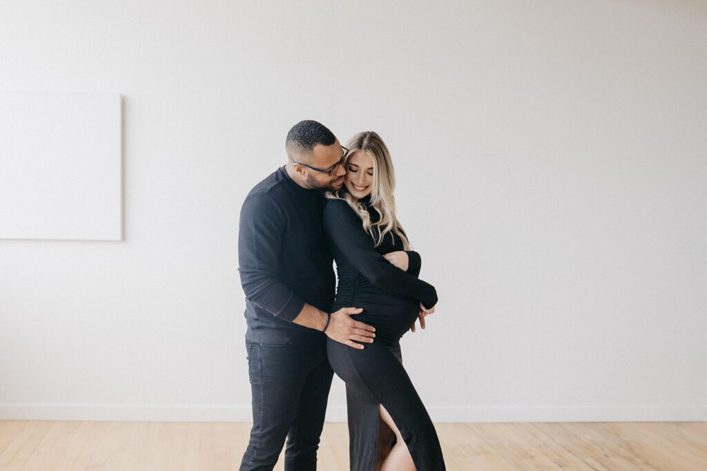 couple hugging during maternity session