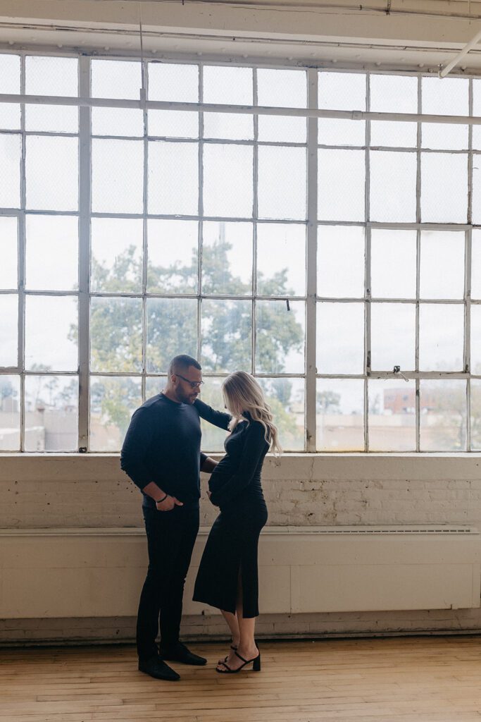 couple standing during maternity session