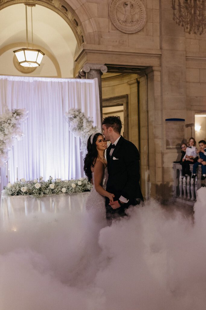 bride and groom first dance with fog and lights at the ariel pearl center ohio wedding photographer