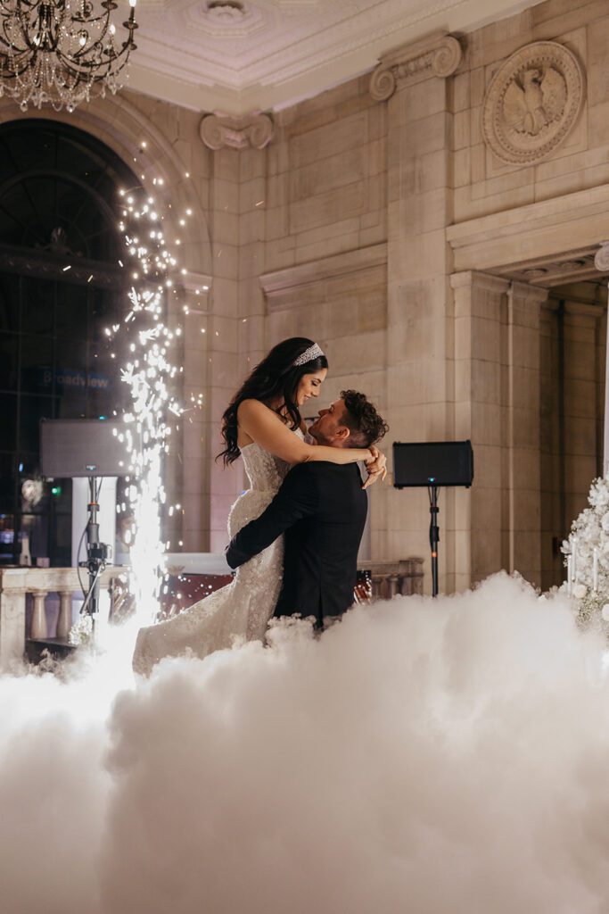 bride and groom first dance with fog and lights at the ariel pearl center ohio wedding photographer