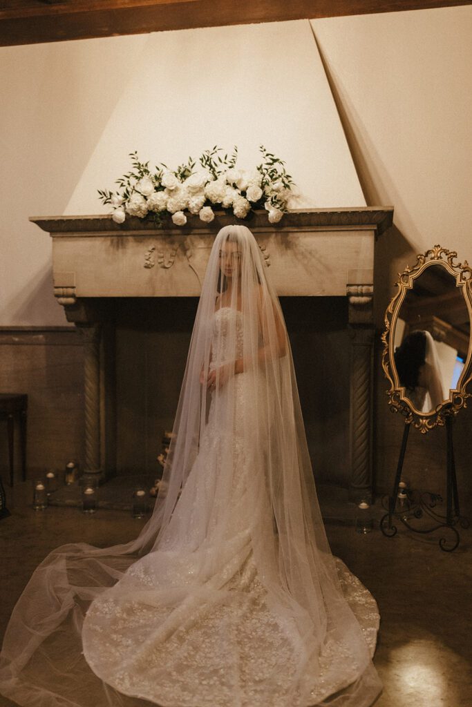 indoor bride getting ready photos with veil and dress