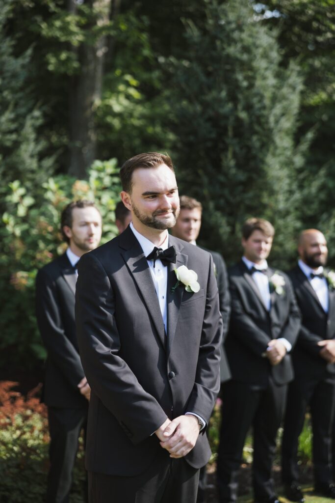 groom crying during wedding ceremony